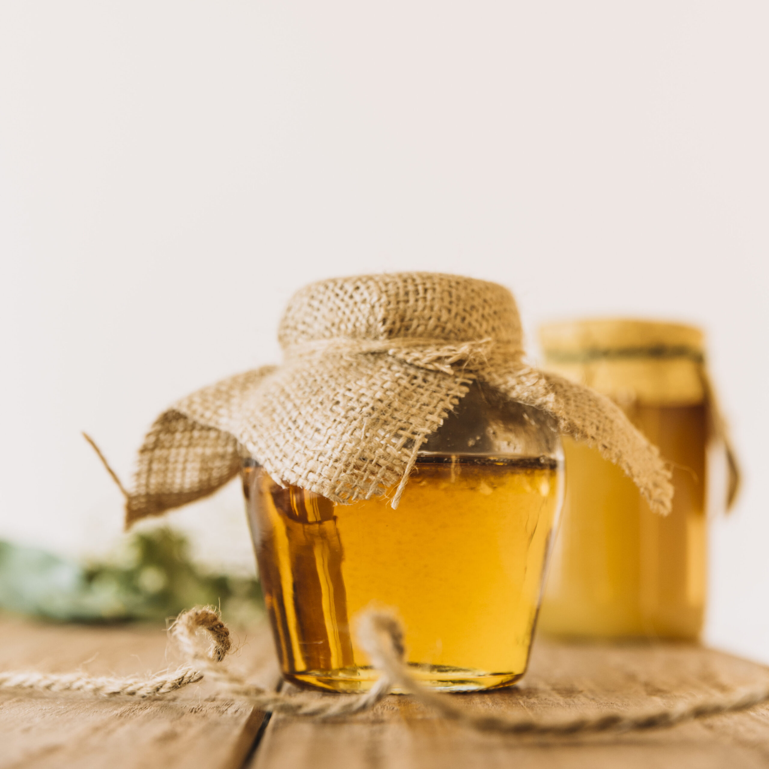 Fresh Honey Closed Jar Wooden Surface Edited Scaled